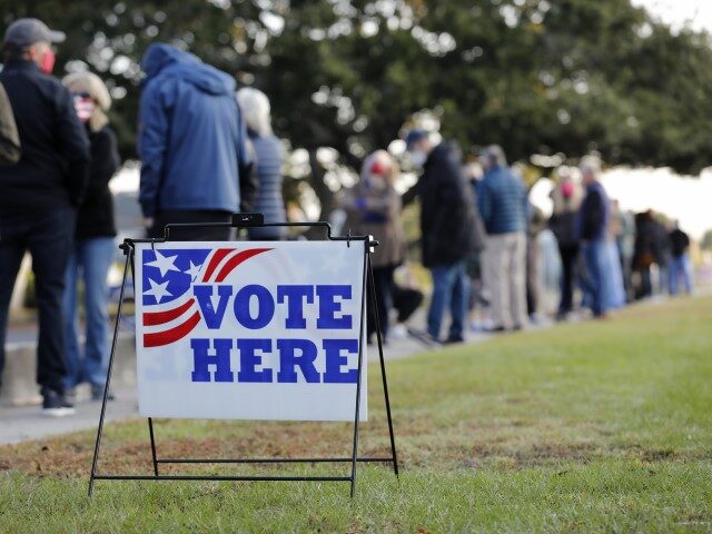 Voters wait for the polls to open on Election Day, at Sunrise Presbyterian Church Tuesday,
