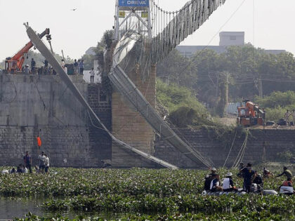 MORBI, INDIA - OCTOBER 31: Rescue personnel conduct search operations after a bridge across the river Machchhu collapsed at Morbi in India's Gujarat state on October 31, 2022. (Photo by Nandan Dave/Anadolu Agency via Getty Images)