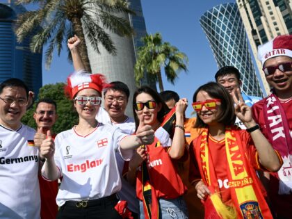 15 November 2022, Qatar, Doha: Chinese fans lined up for a group photo in jerseys. The ope