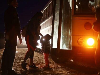 Migrants on buses in Massachusetts towns without warning. ( Mario Tama/Getty Images)