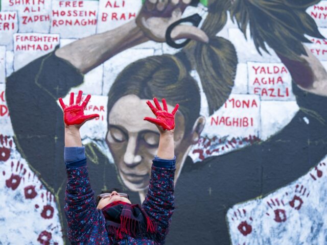 Ella, who is Iranian and has been living in Scotland for seven years, helps to create the Women Life Freedom mural on the side of St Johns Church on Princes Street, Edinburgh. Members of the public are being invited to add their hand-print to the artwork at an event at …