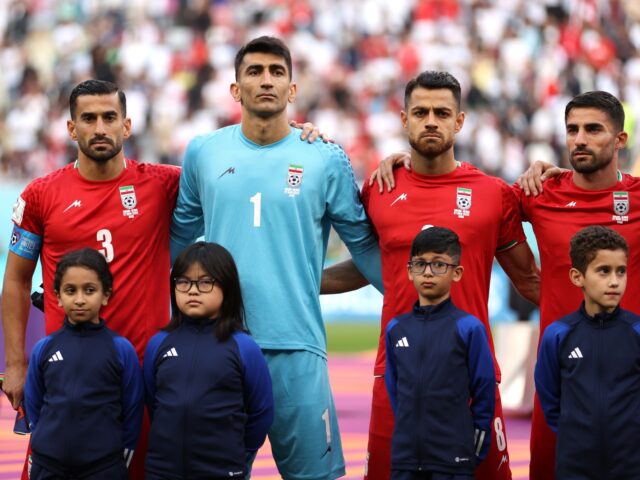 DOHA, QATAR - NOVEMBER 21: Iran players line up for the national anthem prior to the FIFA
