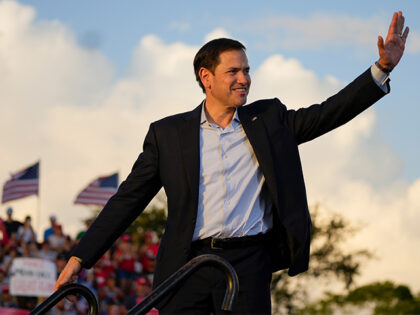 Sen. Marco Rubio, R-Fla., waves after speaking with former President Donald Trump on stage at a campaign rally at the Miami-Dade County Fair and Exposition on Sunday, Nov. 6, 2022, in Miami. (AP Photo/Rebecca Blackwell)