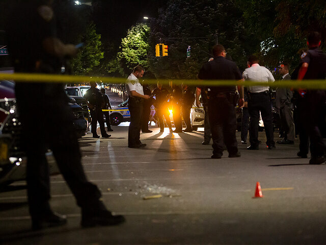 New York Police Department (NYPD) officers investigate the scene of a shooting in the Crown Heights neighborhood in the Brooklyn borough of New York, U.S., on Thursday, July 21, 2022. Homicides in New York City have become more common during the pandemic, jolting the perception of a city once called …