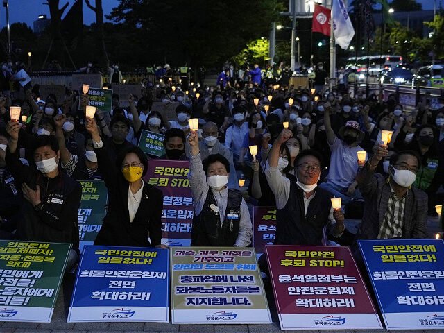 Members of the Public Service and Transport Workers Union stage a rally to support the ongoing trucker strike outside the presidential office in Seoul, South Korea, Tuesday, June 14, 2022. South Korea's prime minister warned Tuesday that the disruption of cargo transport could cause "irrecoverable" damages on the country's economy, …