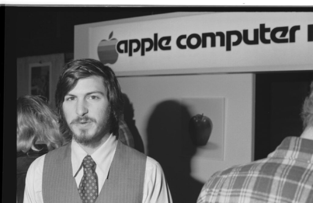 Portrait of American businessman and engineer Steve Jobs, co-founder of Apple Computer Inc, at the first West Coast Computer Faire, where the Apple II computer was debuted, in Brooks Hall, San Francisco, California, April 16th or 17th, 1977. (Photo by Tom Munnecke/Getty Images)