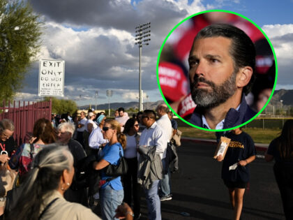 VANDALIA, OHIO - NOVEMBER 07: Donald Trump Jr. listens as former President Donald Trump speaks at a rally at the Dayton International Airport on November 7, 2022 in Vandalia, Ohio. The former president is campaigning for Republican candidates, including U.S. Senate candidate JD Vance, who faces U.S. Rep. Tim Ryan …