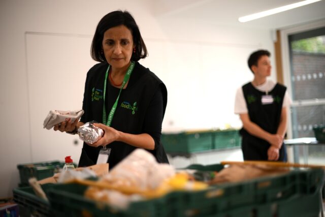 Hundreds of people on Monday queued in front of the food bank in Hackney in east London
