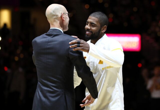 Kyrie Irving, right, met with NBA commissioner Adam Silver in 2016 to receive an NBA champ
