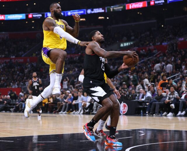 Los Angeles Lakers star LeBron James fouls Paul George in the Lakers' NBA loss to the Los