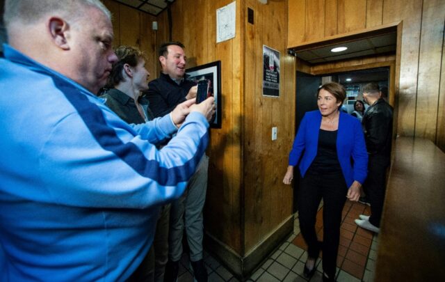 Maura Healey makes her way into a room full of politicians and supporters in Boston, Massa