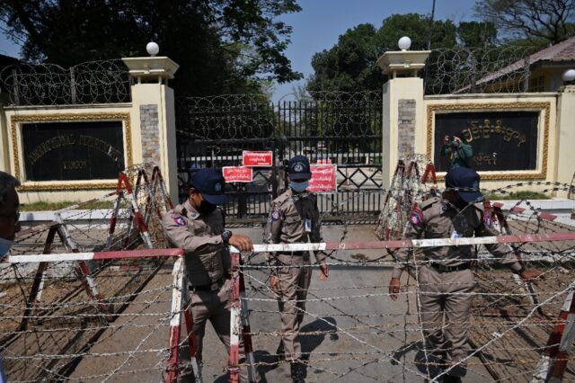 Prison officials prepare for the release of prisoners outside Yangon's Insein prison in Fe