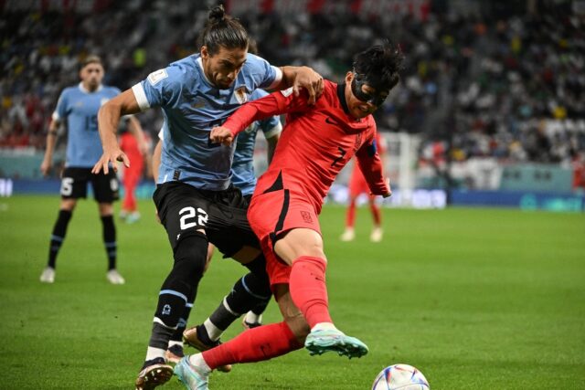 Son Heung-min (right) was a marked man against Uruguay in South Korea's World Cup opener in Doha as the game ended goalless