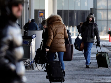 Passengers walk through Terminal 3 at O'Hare International Airport in Chicago, Thursday, Jan. 31, 2019. Chicago's polar vortex freeze makes it the coldest it's been since 1985, as Rockford breaks low temp record at minus 30. Disruptions caused by the cold will persist, too, including power outages and canceled flights …
