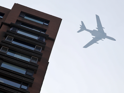 China's H-6 bomber jets flies over a residential building in Beijing, Sunday, Sept. 22, 20