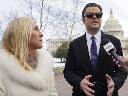 Rep. Matt Gaetz, R-Fla., right, and Rep. Marjorie Taylor Greene, R-Ga., left, speak on the west side of the U.S. Capitol in Washington, Thursday, Jan. 6, 2022, on the one year anniversary of the attack on the U.S. Capitol. (AP Photo/Carolyn Kaster)