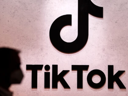 A visitor passes the TikTok exhibition stands at the Gamescom computer gaming fair in Colo