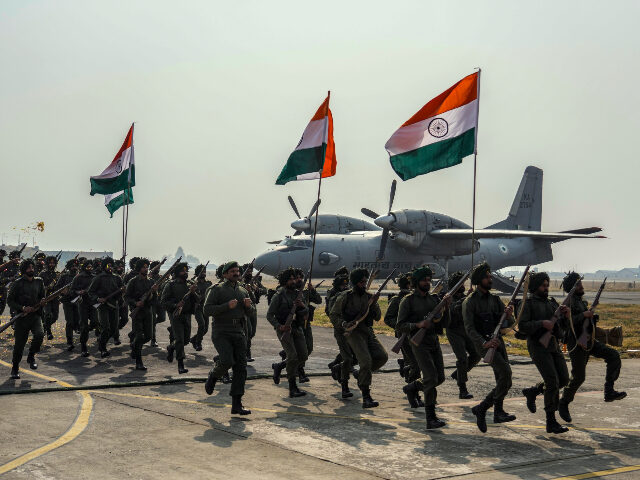 Indian paratroopers perform a re-enactment of the army landing in Srinagar in 1947, at the