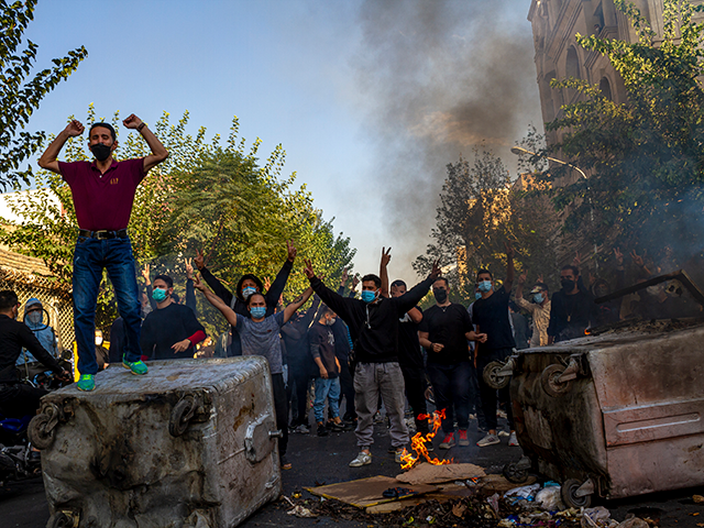 In this photo taken by an individual not employed by the Associated Press and obtained by the AP outside Iran, Iranians protests the death of 22-year-old Mahsa Amini after she was detained by the morality police last month, in Tehran, Thursday, Oct. 27, 2022. (AP Photo/Middle East Images, File)