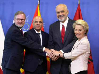 FILE - From right, European Commission President Ursula von der Leyen, Albanian Prime Minister Edi Rama, North Macedonia's Prime Minister Dimitar Kovacevski and Czech Republic's Prime Minister Petr Fiala shake hands prior to a meeting at EU headquarters in Brussels, on July 19, 2022. The war in Ukraine has put …