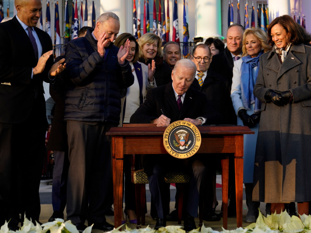 President Joe Biden signs the Respect for Marriage Act, Tuesday, Dec. 13, 2022, on the Sou