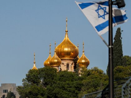 his picture taken on December 20, 2021 shows a view of an Israeli flag flying near the Rus
