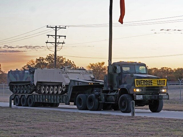 Texas National Guard Soldiers transport M113 Armored Personnel Carriers to the state's border with Mexico as part of increasing border security measures under Operation Lone Star. (Texas Military Department)