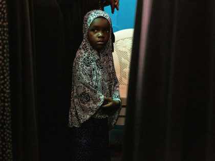 A girl is pictured during a memorial service in Monrovia on September 22, 2019, for victims of a recent fire in a Koranic school in the Liberian capital. - The Monrovia suburb of Paynesville is a town in mourning, as residents seek to come to terms with the loss of …