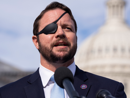 Rep. Dan Crenshaw, R-Texas, speaks during a news conference to introduce the Crucial Communism Teaching Act outside the U.S. Capitol on Thursday, December 2, 2021. The legislation would require high schools to teach the history of communism. (Photo By Tom Williams/CQ-Roll Call, Inc via Getty Images)