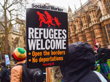 LONDON, UNITED KINGDOM - 2022/01/27: A demonstrator holds a 'Refugees Welcome' placard during the protest. Demonstrators gathered outside the parliament in protest against the Nationality and Borders Bill, which will make it easier for the UK Government to strip people of their citizenship. (Photo by Vuk Valcic/SOPA Images/LightRocket via Getty …