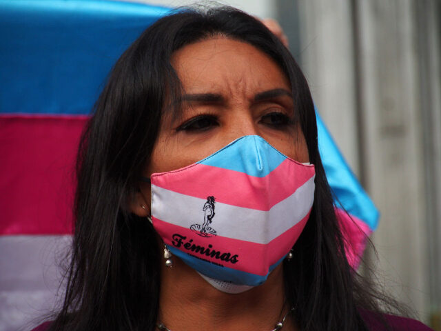 LIMA, PERU - 2022/06/30: A Transgender woman from the LGBT community holds a sit-in in front of the prosecutor's office to protest the lack of security and the aggression and extortion of which they are victims by pimps. On June 29th "Sharon" a transgender woman was shot in Lima downtown …
