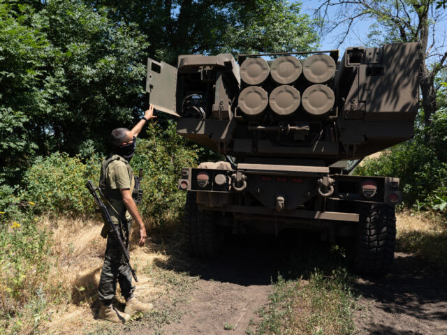 EASTERN UKRAINE , UKRAINE - JULY 1: Kuzia, the commander of the unit, shows the rockets on