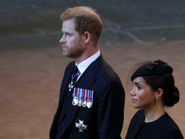 LONDON, ENGLAND - SEPTEMBER 14: Prince Harry and Meghan, Duchess of Sussex walk as process