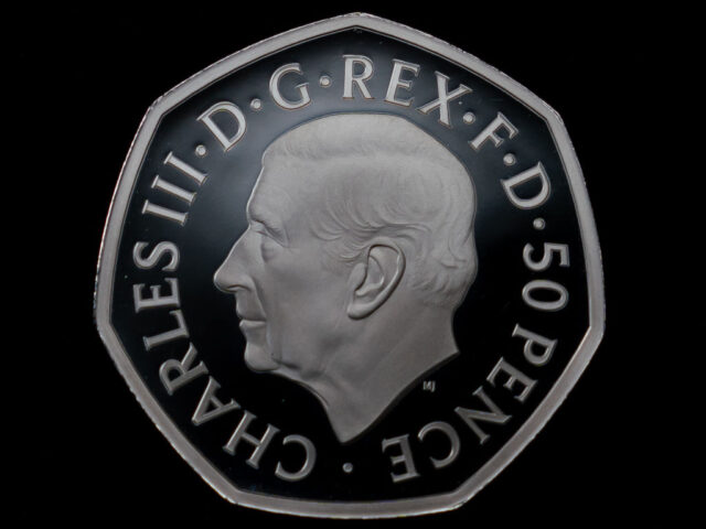 The official coin effigy of King Charles III on a 50 pence commemorating the life and lega