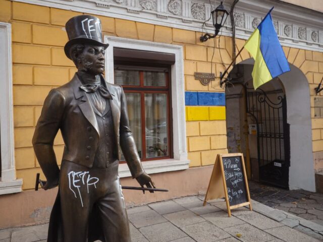A photo shows a statue of Russian poet Alexander Pushkin painted with the words "Go a