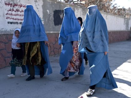 TOPSHOT - Afghan women walk a long a road in Ghazni Province on November 27, 2022. (Photo by Wakil kohsar / AFP) (Photo by WAKIL KOHSAR/AFP via Getty Images)
