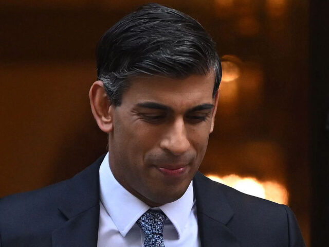 Britain's Prime Minister Rishi Sunak looks down as he leaves 10 Downing Street in central