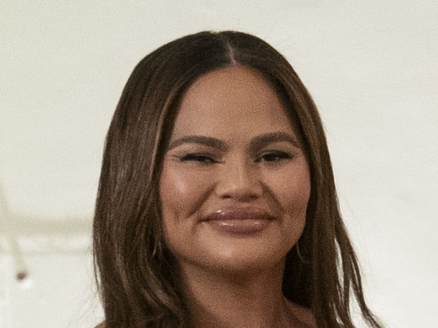 Detail of Chrissy Teigen at the White House on December 1, 2022. (Sarah Silbiger/CNP/Bloomberg via Getty Images)