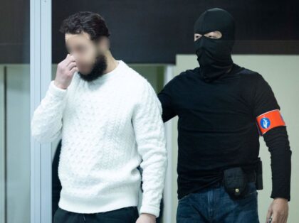 Defendant Salah Abdeslam arrives under police escort for the trial of alleged jihadists accused of directing or aiding suicide bombings in Brussels' metro and airport on March 22, 2016, at the Justitia building in Brussels on December 5, 2022. - - Belgium OUT (Photo by Benoit DOPPAGNE / various sources …