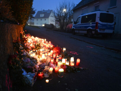 06 December 2022, Baden-Wuerttemberg, Illerkirchberg: Candles and flowers stand at a crime scene where two girls were attacked by a man with a knife the day before. A 14-year-old succumbed to her serious injuries on Monday. Photo: Bernd Weißbrod/dpa (Photo by Bernd Weißbrod/picture alliance via Getty Images)