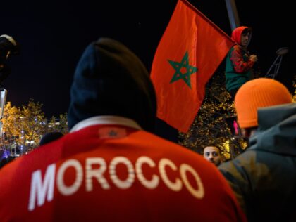 PARIS, FRANCE - DECEMBER 06: Moroccan supporters celebrate victory as Morocco qualified for 2022 FIFA World Cup quarterfinals after beating Spain on penalties during the FIFA World Cup Qatar 2022 Round of 16 match between Morocco and Spain at Champs Elysees in Paris, France on December 06, 2022. (Photo by …