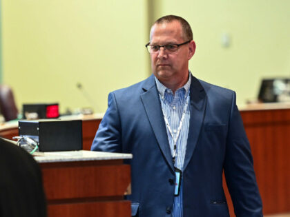 ASHBURN, VA - AUGUST 10: Loudoun County Public Schools Superintendent Scott Ziegler walks to his seat before a school board meeting on August 10, 2021 in Ashburn, Va. The Loudoun school board will vote Tuesday night whether to adopt improved guidelines for the treatment of transgender students that would require …