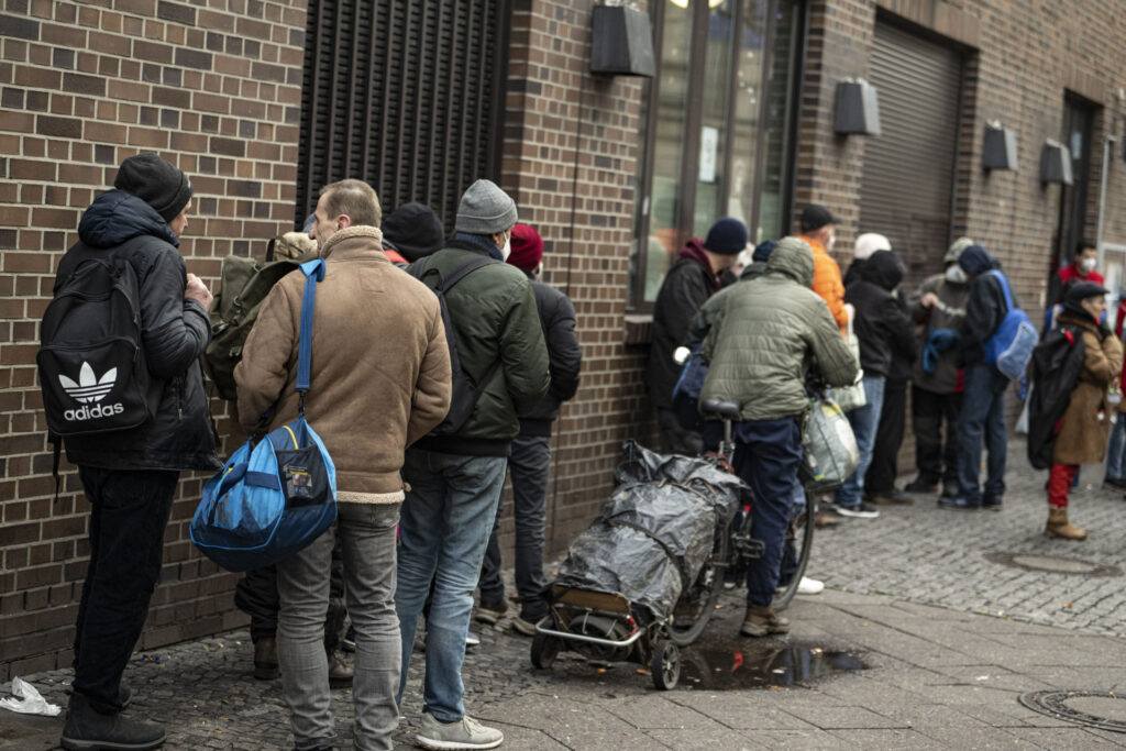 09 December 2022, Berlin: People in need stand in line at the food bank at the Bahnhofsmission am Zoo. Photo: Fabian Sommer/dpa (Photo by Fabian Sommer/picture alliance via Getty Images)