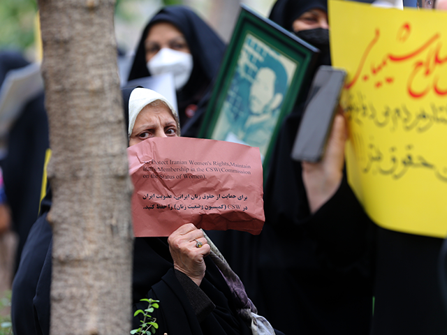 Iranian women gather during a protest outside the United Nations mission headquarters as t
