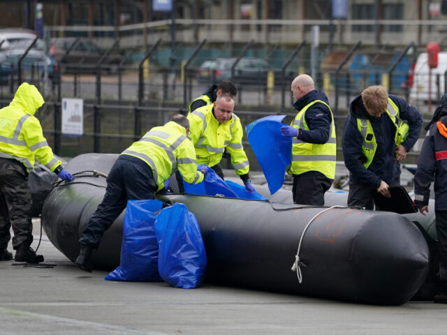 Small boats used to cross the Channel by people thought to be migrants are removed from th