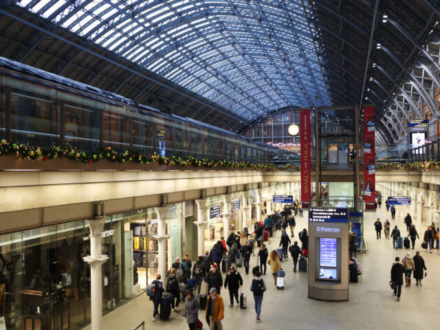 Passengers in a retail arcade at St Pancras International railway station in London, UK, o