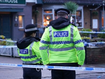 Police officers on duty at the Lighthouse Inn in Wallasey Village, near Liverpool, after a woman died and multiple people were injured in a shooting incident on Christmas Eve. Merseyside Police said officers were called to the pub on Saturday following reports of gunshots. A young woman was taken to …