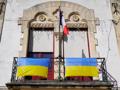 flag ukraine on french city hall facade ukrainian National flag with yellow and blue colors in fabric texture