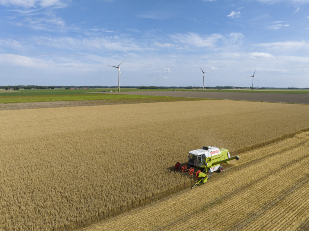DRONTEN, THE NETHERLANDS - AUGUST 4: An aerial view of a combine harvester harvests wheat during summer on August 4, 2022 in Dronten, The Netherlands. More farmers in The Netherlands have taken up cultivating grain as a result of the war in the Ukraine (Photo by Sjoerd van der Wal/Getty Images)