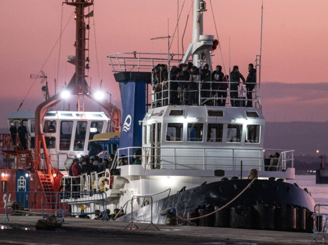 CATANIA, ITALY - NOVEMBER 14: The migrants on the Italian-flagged tugboat 'Macistonè' just arrived in the port of Catania after rescuing migrants off the south-east coast of Calabria. The boat was escorted by patrol boats of the harbour office. The migrants are all male, including 35 unaccompanied minors. They come …